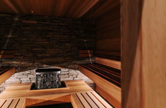 The inside of the IHF Health Club's sauna with wooden interior.
