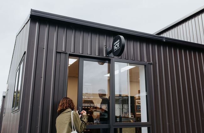 Exterior of a black container style shop at J Friend & Co Honey, Christchurch