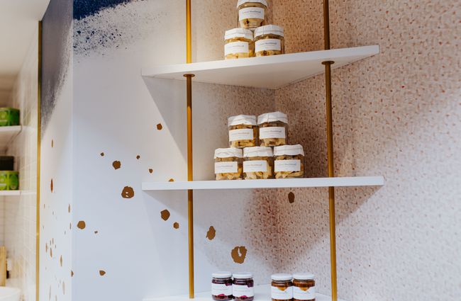 Shelves of caramels in jars at J’aime les macarons in Christchurch.