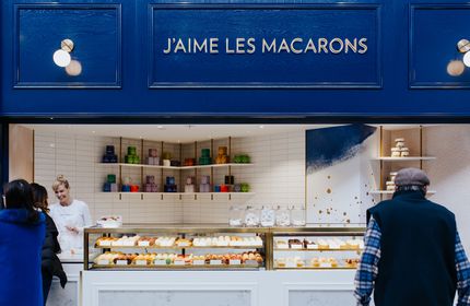 Blue shop exterior and glass cabinet of J’aime les macarons in Christchurch.