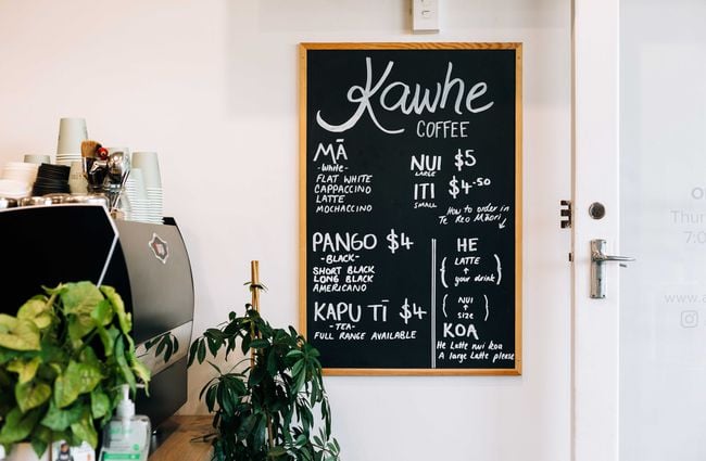 Chalkboard with kawhe prices at Knead Artisan Donuts, New Plymouth.