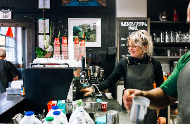 A barista making coffee at L'affare cafe Wellington.