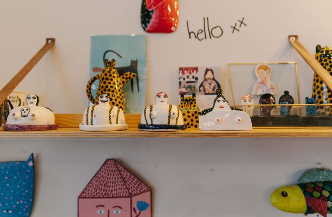 Quirky ornaments on a shelf at Little Beehive Co-op.