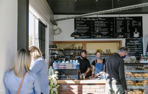 Customers queuing to order at the counter at Little Vintage Espresso.