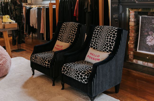 Two armchairs covered in animal print fabric at Liz Thomas.