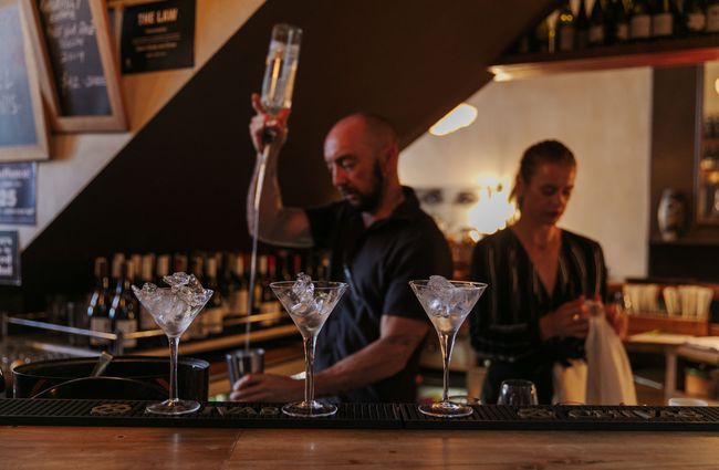 A barman making a cocktail at Louies.