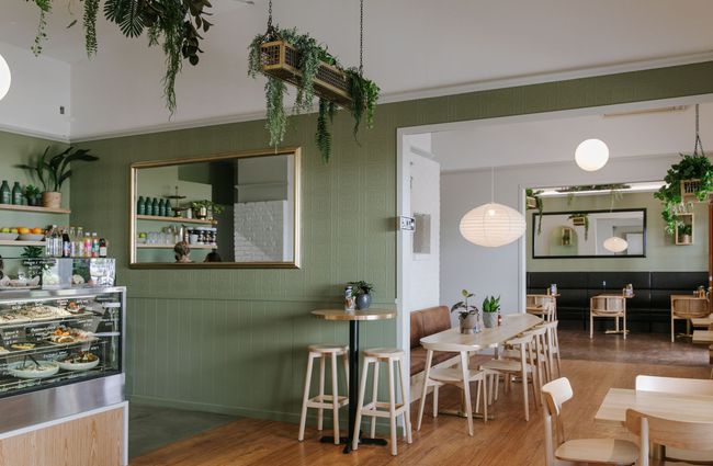 The green, brown and white cafe interior.