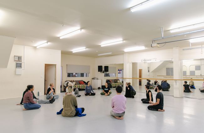 Group of dancers sat in circle before class at Movement Art Practice.