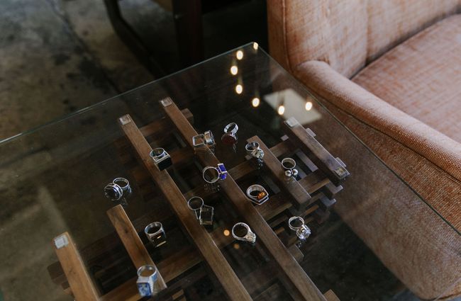Collection of silver rings on a glass table at Mr Mod, Christchurch.