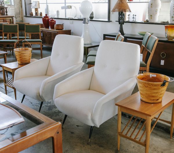 Pair of white armchairs at Mr Mod, Christchurch.