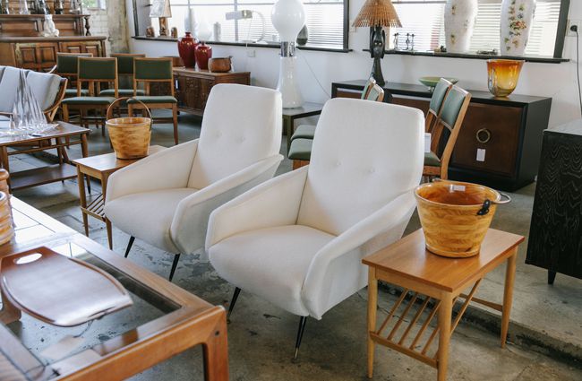 Pair of white armchairs at Mr Mod, Christchurch.