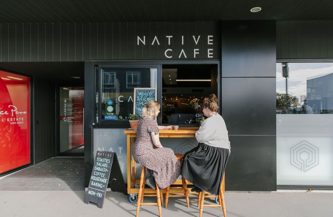 Two women having coffee at the counter outside Native Cafe in Christchurch.