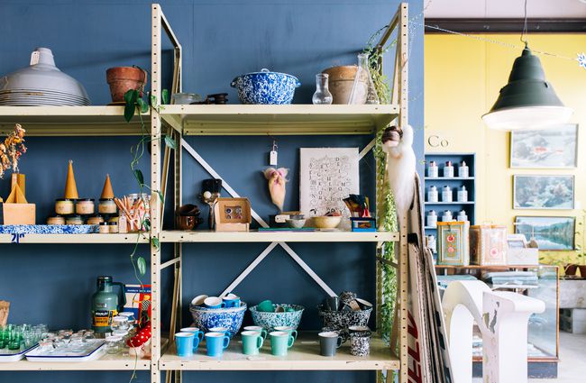 Ceramics, candles and others items on the shelves at Needle in the Hay, Hamilton.