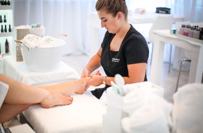 A therapist giving a foot massage at Nicola Quinn Beauty and Day Spa in Merivale, Christchurch.