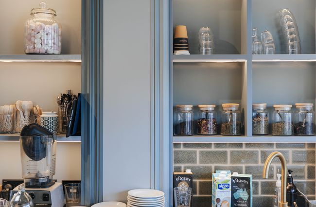 Glass containers on shelves.