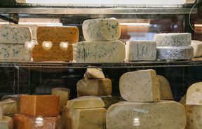 Cheeses on display in fridge at Old Factory Corner, Nelson Tasman.