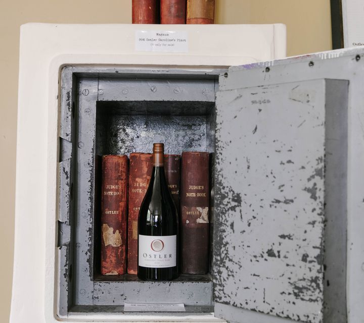 Close up of wine and a couple of books kept in a safe at Vinters Drop in Kurow, Waitaki.