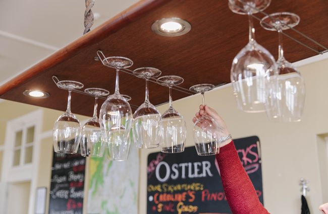 close up of wine glasses in overhead rack at Vinters Drop in Kurow, Waitaki.
