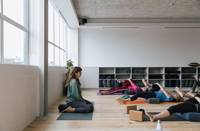 A woman teaching a yoga class at O-Studio in Christchurch.