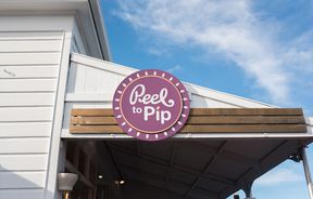 Coloured circle Peel to Pip entrance sign.