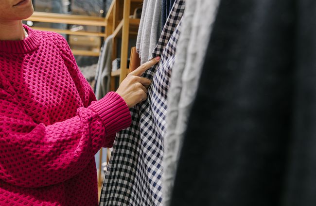 Woman looking at clothing.