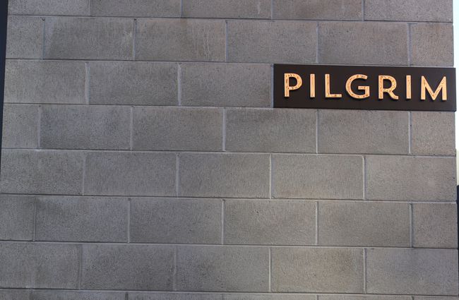 Pilgrim sign on concrete blocks.