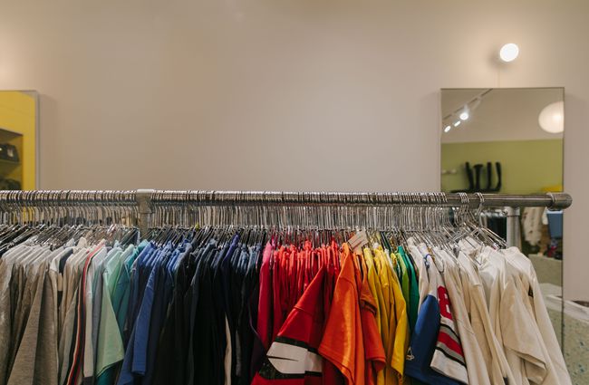Rack of colourful men's t-shirts.