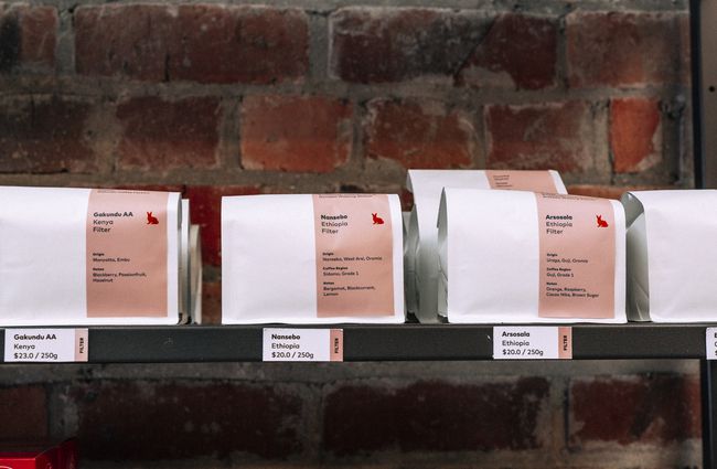 Bags of coffee on a shelf for sale at Red Rabbit, Auckland.