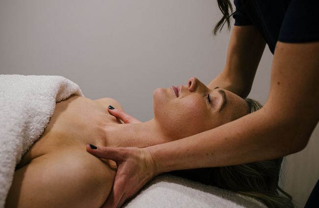 Woman receiving shoulder massage.