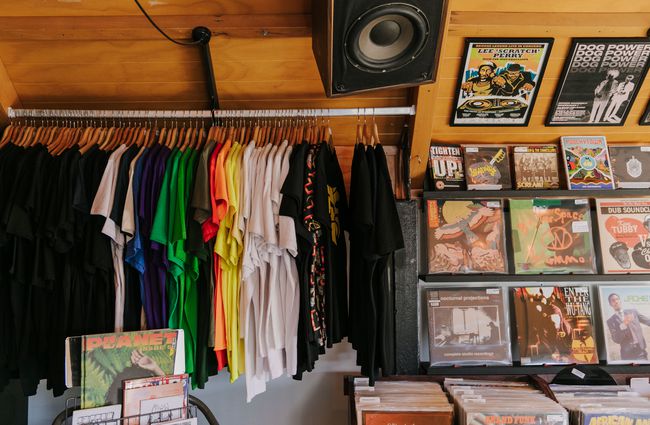 Rack of t-shirts and records on show at Ride On Super Sound.