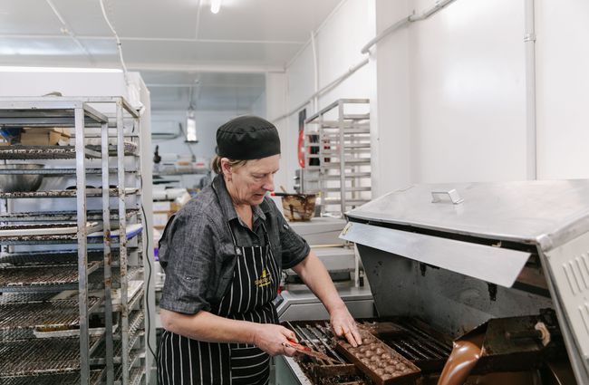 Woman making chocolate at Seriously Good Chocolate Company.