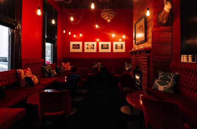 The red lit interior of Snug Lounge in New Plymouth.