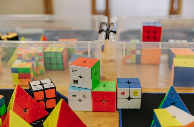 Close up of 2x2 speedcubes on a table.