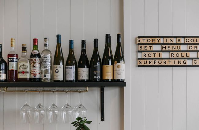 Bottles of wine on a shelf at Story.