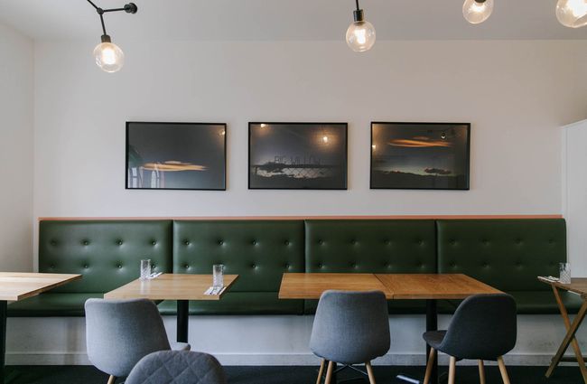 Dining area with green bench seat at Story.