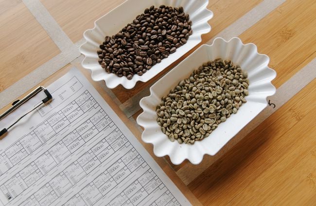 Unroasted and roasted coffee beans in bowls at Sublime Roastery and Brew Bar.