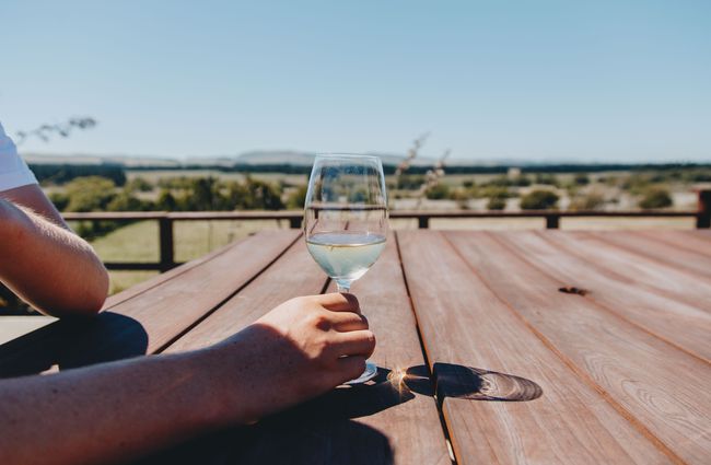 A glass of wine on a table outside Terrace Edge Waipara North Canterbury.