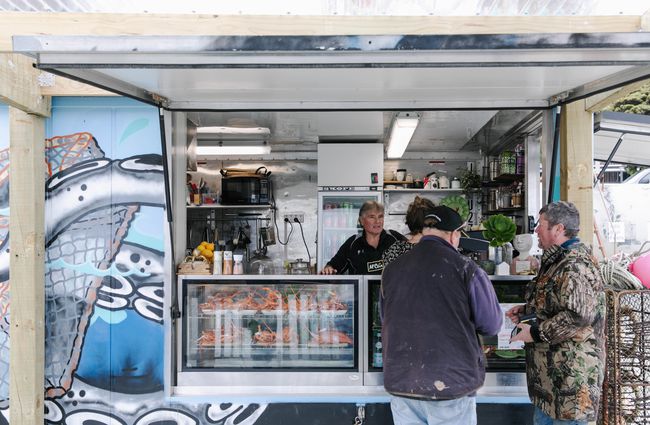 The FishWife counter with customers being served in Moeraki.