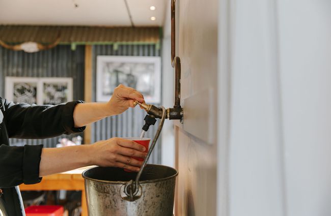 A drink being poured by a staff member at the Greedy Cow Café in Tekapo.