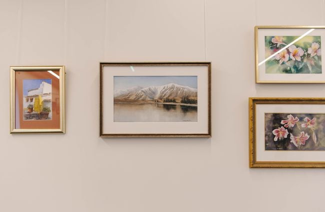 Framed pictures of a mountain on the wall in the exhibition space at The Mayfair.