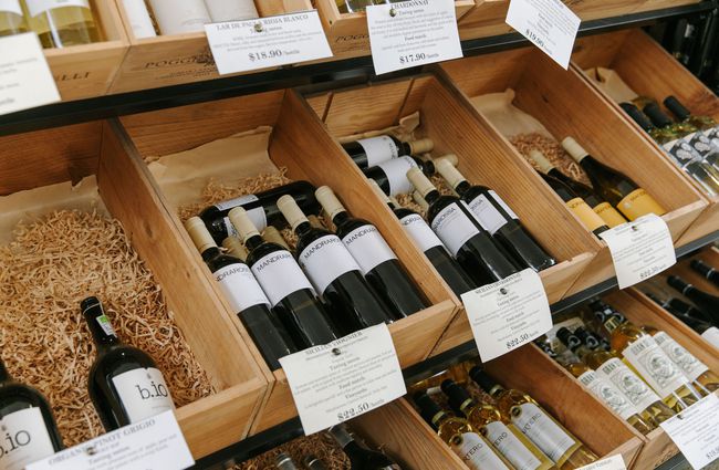 Wine on display in wooden boxes at Mediterranean Food Company, Christchurch.