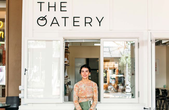 Owner, Anna, sat outside The Oatery.