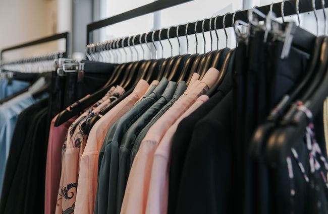 Close up of clothing on a rack.