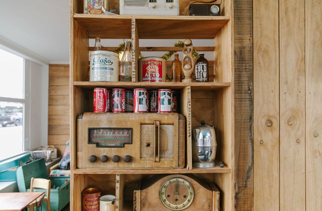A close up of a retro speaker system and old coke cans at The Running Duck cafe in Geraldine.