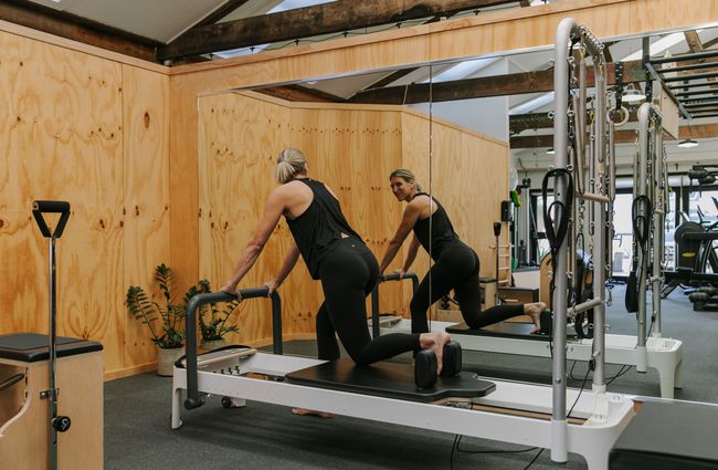 Lady using pilates machine at Well Studio Christchurch.