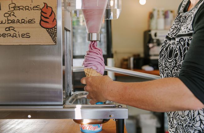 Close up of a woman making a real fruit ice cream in a cone at Three Creeks.