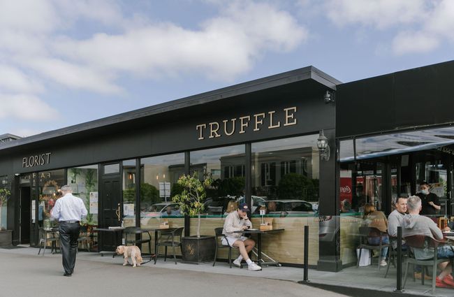 People sitting outside the front of Truffle café, Christchurch.