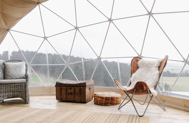 Sitting area in glamping pod with old trunk at Valley Views Glamping in Waitaki.