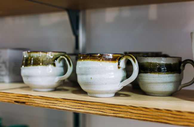 Cups on a shelf.