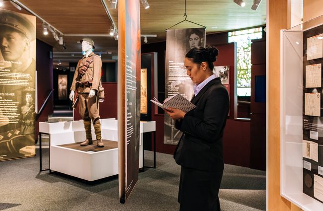 Woman reading notebook at Waikato Museum, Hamilton.